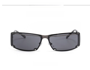 Front view of Y2K sunglasses with black lenses and gunmetal hollow frames on white background