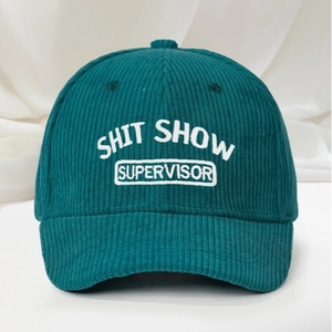 Dark green corduroy baseball cap with white Shit Show Supervisor embroidery