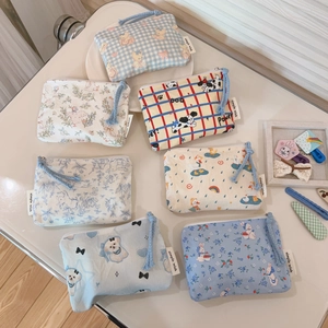 Set of mini cotton canvas pouches with cute cartoon prints and zipper for storage