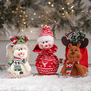 Christmas gift bags set with snowman, reindeer and red knit characters for holiday treats
