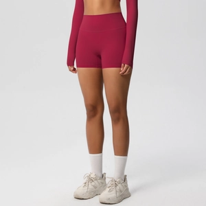 Detail view of high-waist burgundy yoga shorts with seamless high-stretch stitching