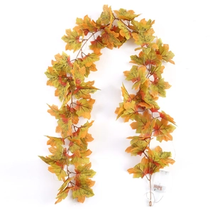 Detail of autumn maple leaf garland with LED lights and battery box for fall decor