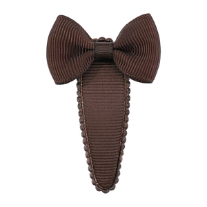 Detailed view of the dark brown grosgrain ribbon texture and bow design on the hair clip