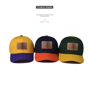 Detailed view of three two-tone baseball caps featuring embossed US flag leather patches