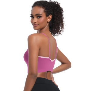 Detail of rose pink yoga bra with cross straps and V-shaped seamless back design