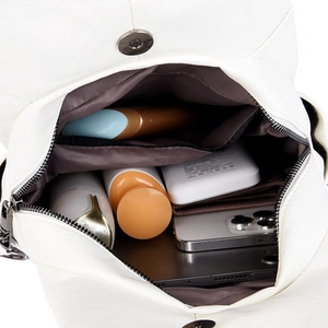 Multifunctional white leather backpack showing spacious interior with multiple compartments