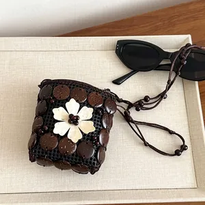Bohemian handmade coconut shell crossbody bag with 3D floral accent for vacation