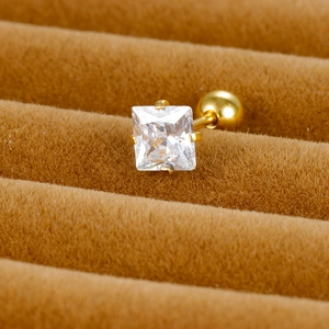 Detailed macro view of a square-cut zircon stud earring with a gold screw ball back