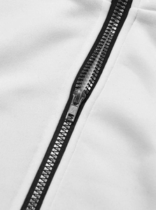 Detailed close-up of high-quality metal zipper and knit fabric on men's hoodie