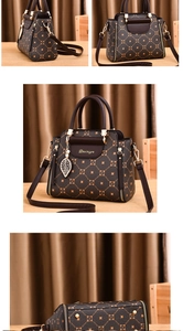 Detail view of brown monogram handbag with gold hardware and leaf pendant charm