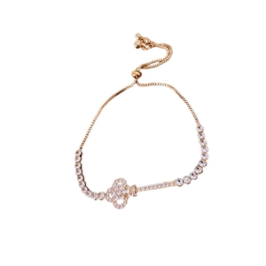 Rose gold adjustable key bracelet with cubic zirconia paving in a minimalist style