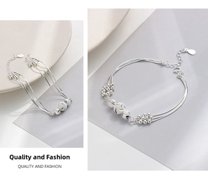 Macro detail of S925 sterling silver multi-layer beaded bracelet with frosted spheres