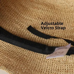 Close-up of internal adjustable velcro strap for size adjustment on raffia sun hat