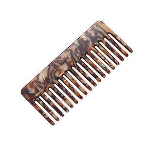 Minimalist tortoiseshell acetate wide-tooth comb for straight hair with a vintage aesthetic
