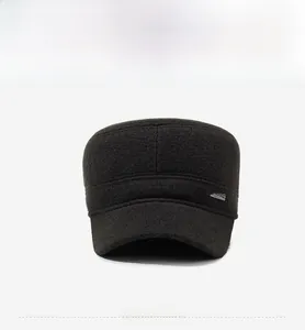 Detail of flat top winter cap with ear flaps and metallic Sports logo on side