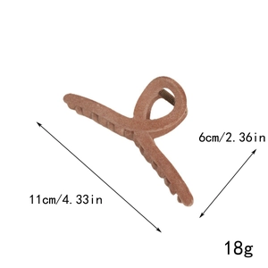 Close-up of large velvet hair claw clip in dark red with exact size measurements