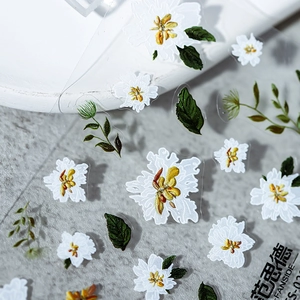 3D embossed nail stickers featuring delicate white flowers with green leaves on clear film