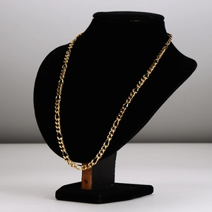 Classic 5.5mm Figaro 3:1 gold stainless steel chain necklace on black display stand