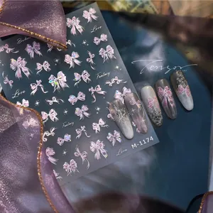 Macro shot of 3D bowknot nail art stickers M-1174 with purple laser texture and stars