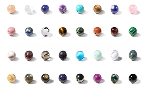 Detailed macro shot of 8mm natural striped agate beads in assorted colors and textures