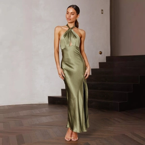 Detail of olive green satin halter neck dress with front keyhole cutout and elegant drapes