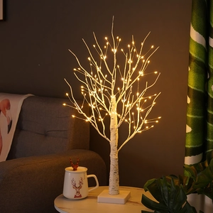 Decorative warm white LED birch tree lamp for cozy indoor Christmas party settings