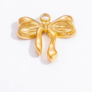 Polished 18k gold plated stainless steel bow pendant accessory on white background