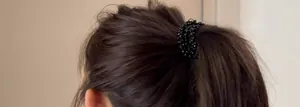 Close-up of sparkling black beaded multi-layer hair tie worn on a high ponytail