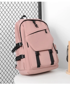 Detail of pink large capacity backpack showing black buckles and multi-pocket design