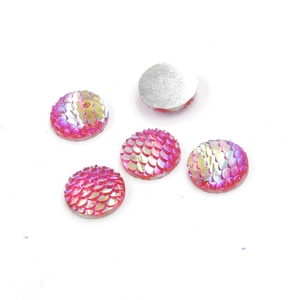 Detailed view of 14mm round pink resin scales with rainbow shimmer and flat silver back