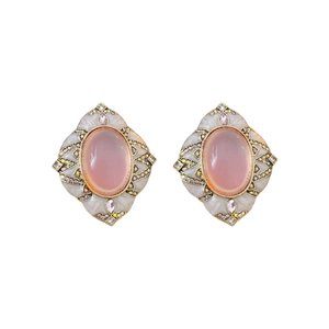 Vintage style pink oval gemstone earrings with gold-toned metal and diamond accents