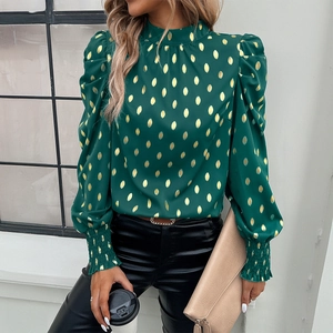 Women's green blouse with gold polka dots, stand collar, and elegant puff sleeves