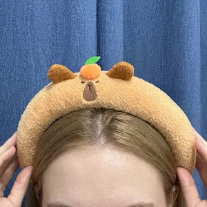 Cute Capybara plush headband for face washing with a small orange ornament on top
