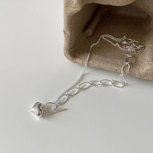925 Sterling silver heart necklace with unique asymmetrical chain on white background