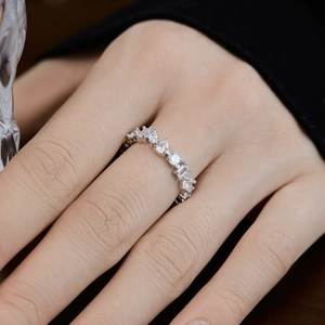 Detail of silver sterling ring with marquise and round cut zircons on a hand