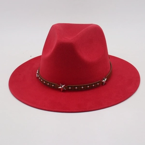 Red wide brim cowboy hat with brown leather band featuring silver stars and studs