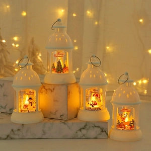 Set of four white Christmas lanterns with LED lights and festive holiday scenes