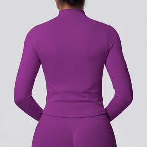 Detail of purple athletic jacket featuring ribbed texture and breathable seamless back design