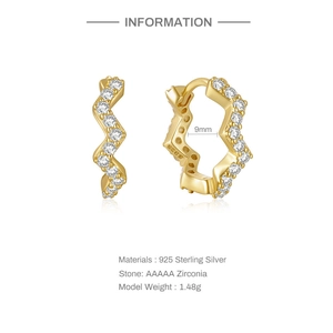 Detail view of 925 sterling silver wavy hoop earrings with AAAAA zirconia and 9mm inner diameter