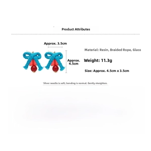 Detail view of blue woven bow earrings with red beads, size 4.5cm and 11.3g weight