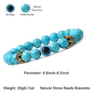 Natural white howlite beaded bracelet with evil eye charm and golden crown accent