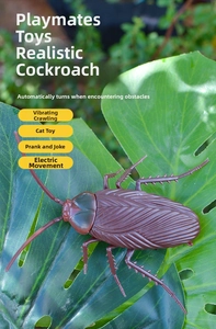 Macro detail of a brown realistic electric cockroach toy on a green tropical leaf