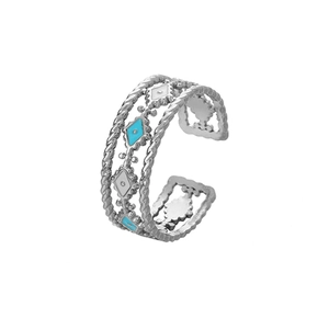 Detail of silver hollowed rings with blue enamel rhombus patterns and rope texture