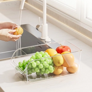 Clear plastic egg and fruit storage bin with ergonomic opening for fridge organization