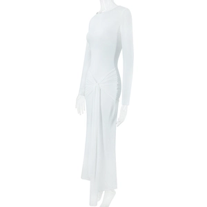 Detail of white slim fit long sleeve dress showing side waist knot and ruching effects