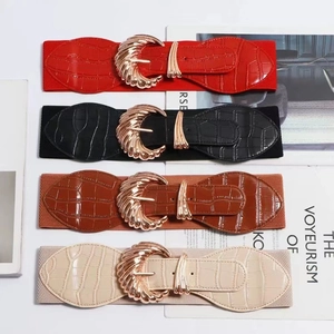 Set of four elastic waist belts with gold leaf buckles in red, black, brown, and beige