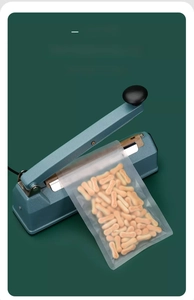 Detail of manual heat sealer for frosted snack bags showing double sealing process