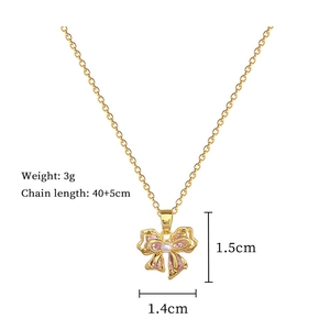 Detail view of pink bow necklace with pearl accent and precise product measurements