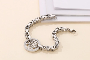 Macro view of Byzantine chain link bracelet with Hamsa Hand pendant and sparkling zircons