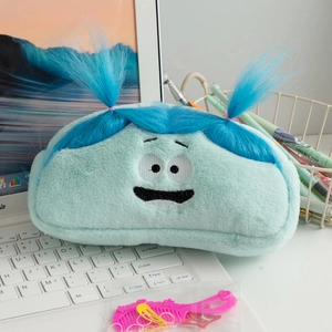 Detail of funny blue plush pencil case with long hair and cartoon embroidery on keyboard